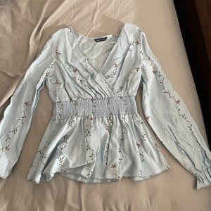 Surplice Neck Shirred Waist Peplum Blouse